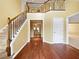 Welcoming foyer with hardwood floors, staircase, and neutral paint colors at 439 Emerald Trce, Jonesboro, GA 30236