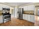 Well-equipped kitchen with granite countertops and stainless steel appliances at 439 Emerald Trce, Jonesboro, GA 30236