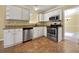 Cozy kitchen with stainless steel appliances, granite countertops, and ample cabinet space at 439 Emerald Trce, Jonesboro, GA 30236