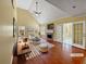 Bright living room with vaulted ceilings, fireplace, hardwood floors and access to patio at 439 Emerald Trce, Jonesboro, GA 30236