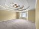 Spacious main bedroom with decorative ceiling, large window and comfortable carpeting at 439 Emerald Trce, Jonesboro, GA 30236