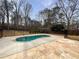 Backyard pool surrounded by a well-maintained fence and beautiful stone at 439 Emerald Trce, Jonesboro, GA 30236