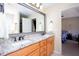 This bathroom offers double sinks, granite counters, and brushed nickel hardware at 4570 Grove Park Nw Way, Acworth, GA 30101