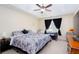 Bright bedroom with ceiling fan and tray ceiling at 4570 Grove Park Nw Way, Acworth, GA 30101