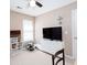 Cozy bedroom with ceiling fan, neutral carpet, and lots of light at 4570 Grove Park Nw Way, Acworth, GA 30101