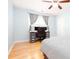 Bedroom with hardwood floors and a ceiling fan at 4570 Grove Park Nw Way, Acworth, GA 30101