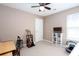 Cozy bedroom with a ceiling fan, neutral paint, and a window providing natural light at 4570 Grove Park Nw Way, Acworth, GA 30101