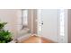 Bright entryway with hardwood floors and a staircase leading to the upper level at 4570 Grove Park Nw Way, Acworth, GA 30101
