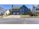 Charming two-story home with a two-car garage and a well-manicured lawn at 4570 Grove Park Nw Way, Acworth, GA 30101