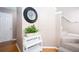Hallway featuring staircase, clock and decorative shelving at 4570 Grove Park Nw Way, Acworth, GA 30101