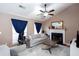 Cozy living room with a vaulted ceiling, fireplace, and comfortable seating arrangement at 4570 Grove Park Nw Way, Acworth, GA 30101