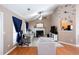 Cozy living room with a vaulted ceiling, fireplace, entertainment center, and ceiling fan at 4570 Grove Park Nw Way, Acworth, GA 30101