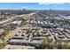 Aerial view of a residential complex with dense trees and surrounding commercial buildings at 5629 Kingsport Dr # 11, Atlanta, GA 30342