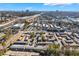 Aerial view of a residential complex with dense trees, city skylines, and surrounding commercial buildings at 5629 Kingsport Dr # 11, Atlanta, GA 30342