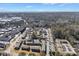 Aerial view of residential complex in a suburban area with mature trees and skyline in distance at 5629 Kingsport Dr # 11, Atlanta, GA 30342