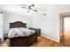 The bright bedroom includes hardwood floors, a ceiling fan and lots of natural light at 5629 Kingsport Dr # 11, Atlanta, GA 30342