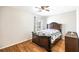 A cozy bedroom features hardwood floors, natural light, and warm neutral paint at 5629 Kingsport Dr # 11, Atlanta, GA 30342