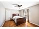 Cozy bedroom with warm hardwood floors, natural light, and a comfortable bed at 5629 Kingsport Dr # 11, Atlanta, GA 30342