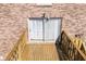 This wooden deck area has a sliding glass door for backyard access at 5629 Kingsport Dr # 11, Atlanta, GA 30342