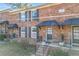 Charming brick townhomes featuring black shutters, covered entries, and well-maintained landscaping at 5629 Kingsport Dr # 11, Atlanta, GA 30342