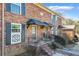 Traditional brick townhouse featuring black shutters and a covered doorway at 5629 Kingsport Dr # 11, Atlanta, GA 30342