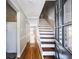 Inviting foyer with hardwood floors and staircase, showcasing the home's interior layout at 5629 Kingsport Dr # 11, Atlanta, GA 30342