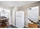 View of kitchen appliances, refrigerator and dining area, creating an inviting atmosphere at 5629 Kingsport Dr # 11, Atlanta, GA 30342