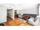 Inviting living room with hardwood floors, gray sofa, and a view of the dining area at 5629 Kingsport Dr # 11, Atlanta, GA 30342