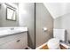 A clean powder room with a white sink and toilet, offering convenience and functionality at 5629 Kingsport Dr # 11, Atlanta, GA 30342