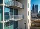 Modern apartment building featuring private balconies with views of the city skyline and attractive design at 860 Peachtree Ne St # 917, Atlanta, GA 30308