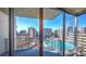 Balcony view overlooking a rooftop pool and city skyline, showcasing the unit's prime location at 860 Peachtree Ne St # 917, Atlanta, GA 30308