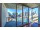 Balcony with city and pool views from a high-rise apartment with bright sunshine and blue skies at 860 Peachtree Ne St # 917, Atlanta, GA 30308