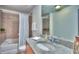 Bathroom featuring a bathtub, a toilet, a single vanity with granite countertops, and a large mirror at 860 Peachtree Ne St # 917, Atlanta, GA 30308