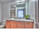 Modern bathroom featuring a vanity with a large mirror and ample lighting at 860 Peachtree Ne St # 917, Atlanta, GA 30308
