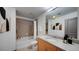 Well-lit bathroom with granite countertop vanity, modern sink and a tiled shower-tub combination at 860 Peachtree Ne St # 917, Atlanta, GA 30308
