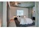 Modern bedroom featuring a comfortable bed, a ceiling fan, and an exposed concrete ceiling at 860 Peachtree Ne St # 917, Atlanta, GA 30308