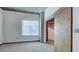 Bright bedroom featuring a large window, a closet, neutral walls, and gray carpet at 860 Peachtree Ne St # 917, Atlanta, GA 30308