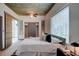 Inviting bedroom featuring a comfy bed, access to a balcony, and natural light from a large window at 860 Peachtree Ne St # 917, Atlanta, GA 30308