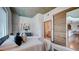 Charming bedroom with a comfortable bed, concrete ceiling, and access to the bathroom and kitchen at 860 Peachtree Ne St # 917, Atlanta, GA 30308