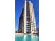 Upscale apartment building featuring a swimming pool and modern architecture, creating a luxurious urban living experience at 860 Peachtree Ne St # 917, Atlanta, GA 30308