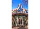 The entrance of the Spire Midtown building with a modern glass facade at 860 Peachtree Ne St # 917, Atlanta, GA 30308