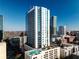 Modern high-rise with balconies, cityscape views, and a rooftop pool at 860 Peachtree Ne St # 917, Atlanta, GA 30308