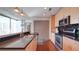 Modern kitchen featuring stainless steel appliances, black granite countertops and an eat-in bar at 860 Peachtree Ne St # 917, Atlanta, GA 30308