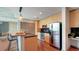 Stylish kitchen with stainless steel appliances, wooden cabinets, and a breakfast bar area at 860 Peachtree Ne St # 917, Atlanta, GA 30308