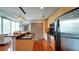 Modern kitchen featuring stainless steel appliances, dark backsplash, and an island with a breakfast bar at 860 Peachtree Ne St # 917, Atlanta, GA 30308
