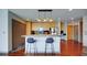 Kitchen bar featuring stainless steel appliances, wooden cabinets, and sleek countertops at 860 Peachtree Ne St # 917, Atlanta, GA 30308