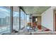 Bright living room with floor-to-ceiling windows and modern furnishings showcases the city skyline views at 860 Peachtree Ne St # 917, Atlanta, GA 30308