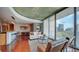 Spacious living room featuring wood floors, a modern kitchen, and large windows with beautiful city views at 860 Peachtree Ne St # 917, Atlanta, GA 30308