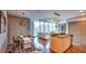 Bright living space featuring an open floor plan with wood floors and floor-to-ceiling windows with city views at 860 Peachtree Ne St # 917, Atlanta, GA 30308
