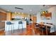 Open floor plan featuring kitchen and dining area with stainless steel appliances and modern lighting at 860 Peachtree Ne St # 917, Atlanta, GA 30308